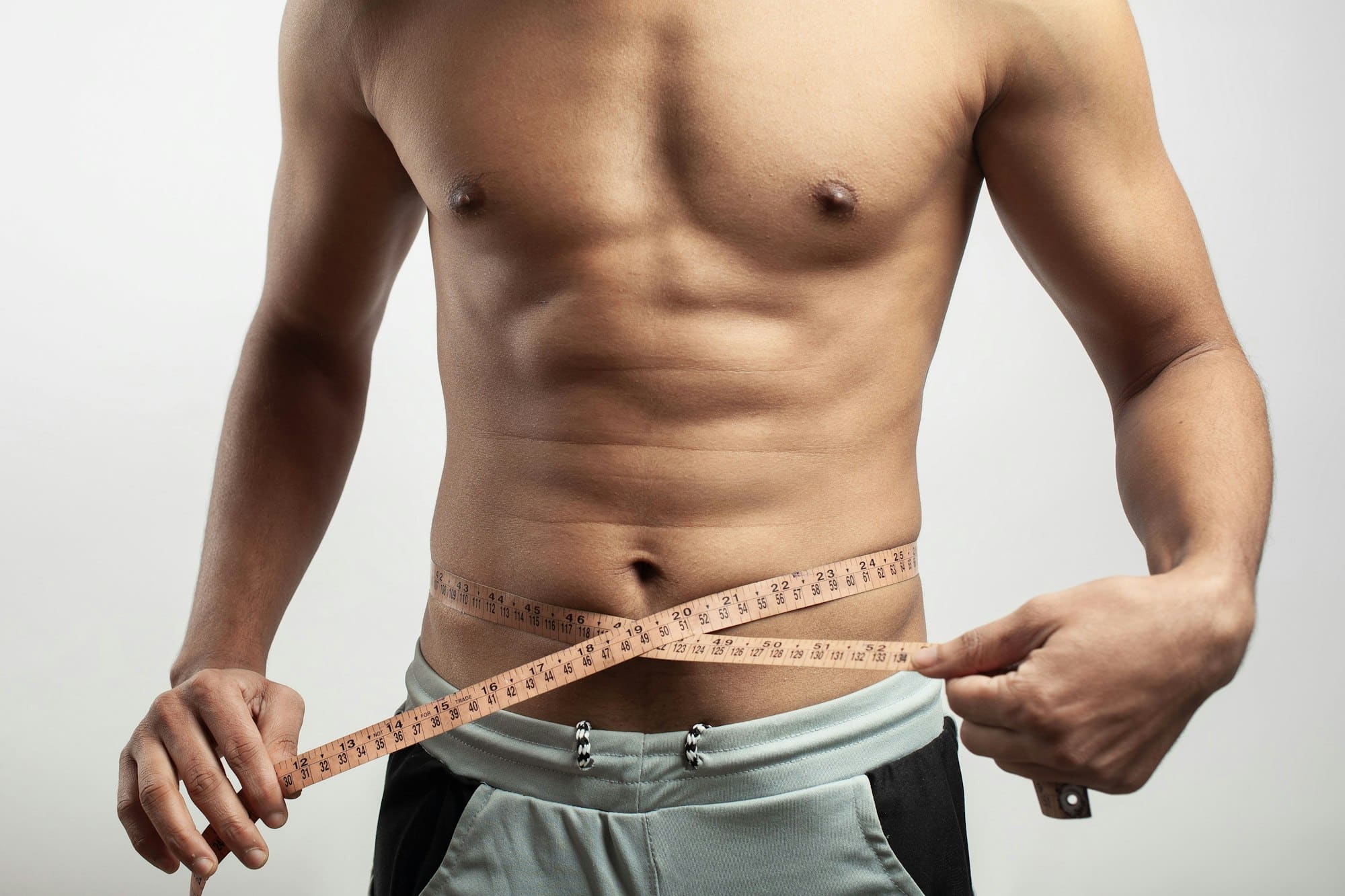 measuring tape around belly, slim fit lifestyle